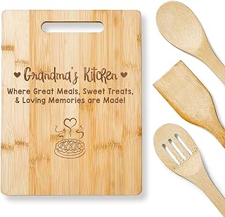 A large wood cutting board with wooden spoons alongside it