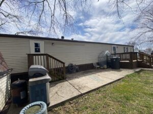 A couple porches at each entrance door to a mobile home