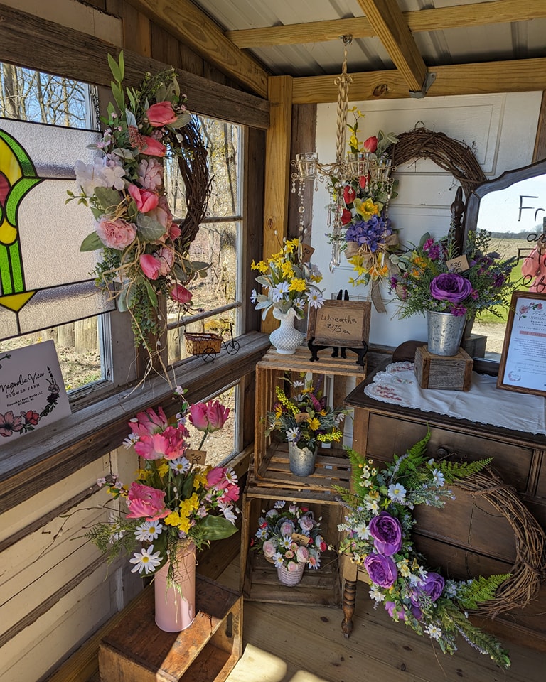 The inside of a woman cave mobile home shed with flowers