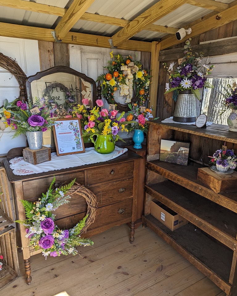Beautiful arrangements of flowers in a mobile home shed
