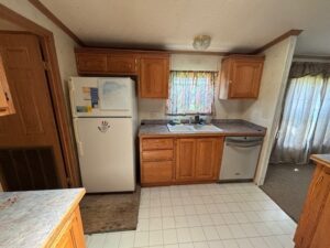 A large kitchen in a doublewide mobile home