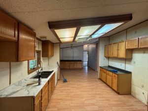 The inside of a doublewide kitchen area