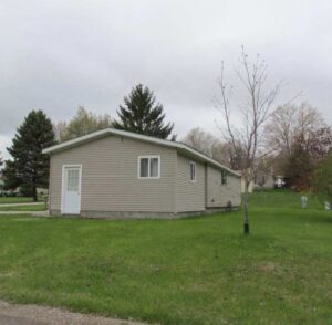 A brown doublewide in rudgate mobile home park