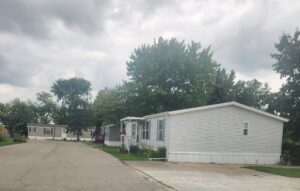 A doublewide mobile home in a park